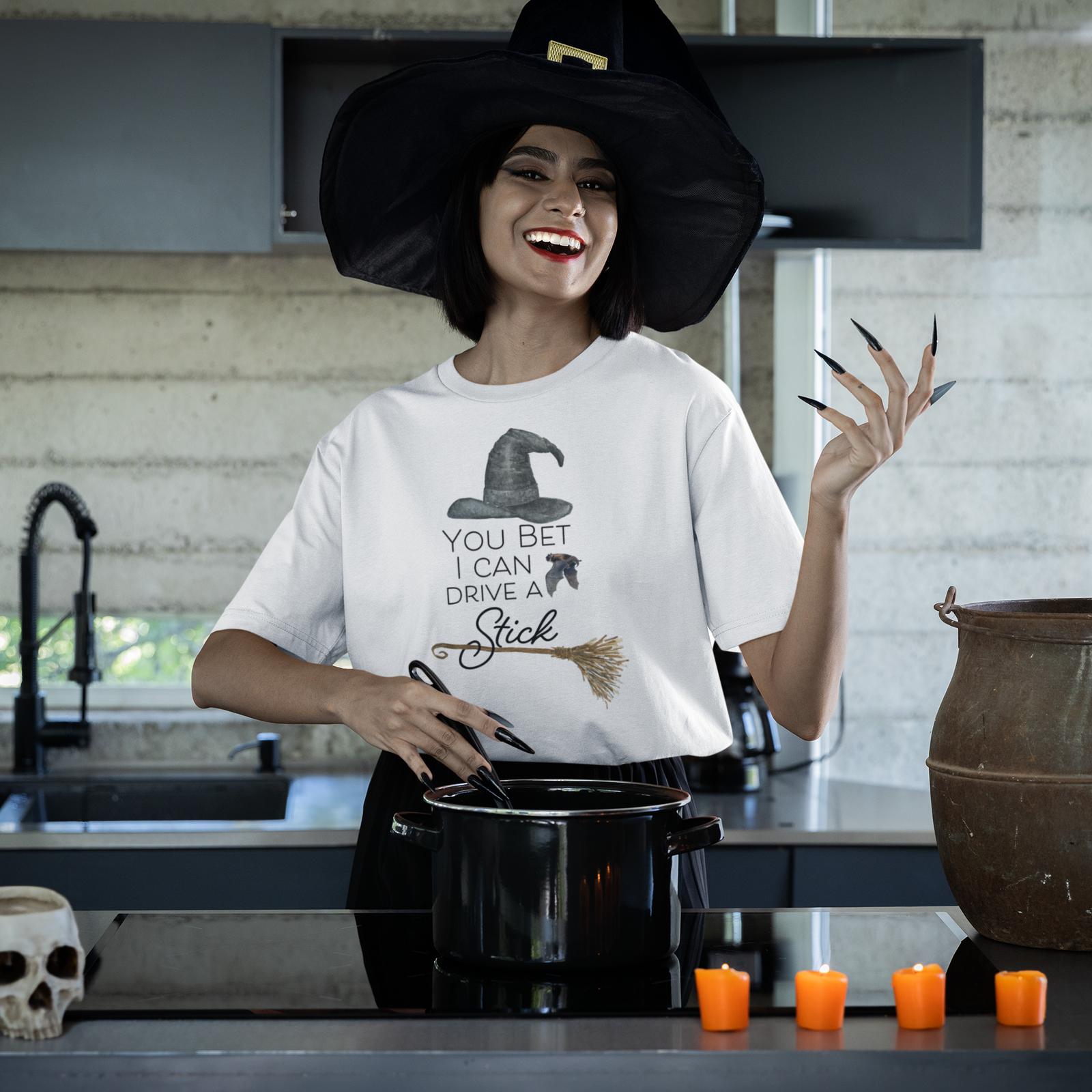 https://larissamadethis.com/cdn/shop/files/stanley-stella-tee-mockup-of-a-smiling-witch-cooking-in-a-modern-kitchen-m35486_1600x.png?v=1694047850
