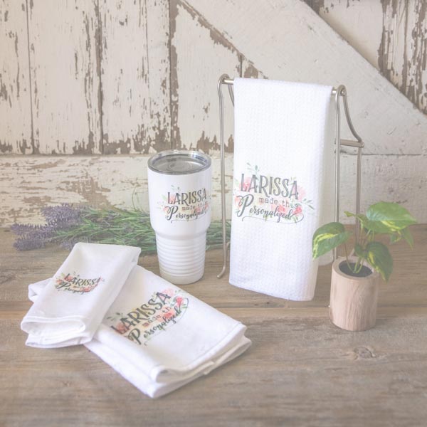 A beautiful collection of items with my Larissa Made This Personalized business logo, including 30 ounce tumbler, dishtowel, guest towel and hand towel.