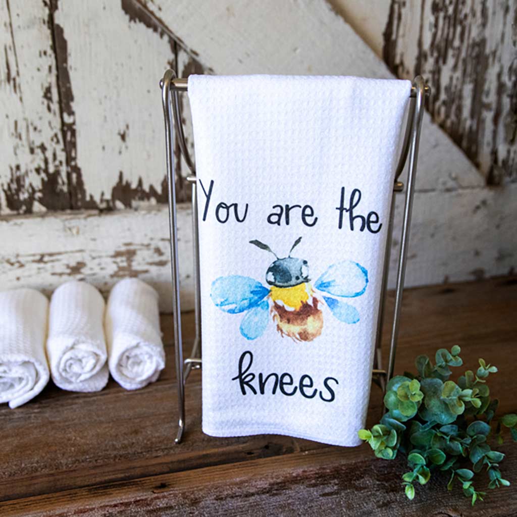 Waffle dishtowel with a large watercolor bee that says, "You are the bees knees"