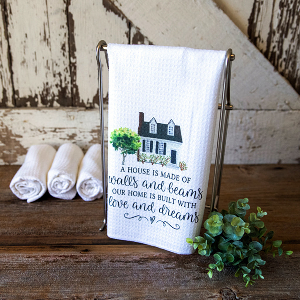 A House is Made With Walls and Beams.  Our Home Is Made With Love And Dreams dish towel with a beautiful watercolor house
