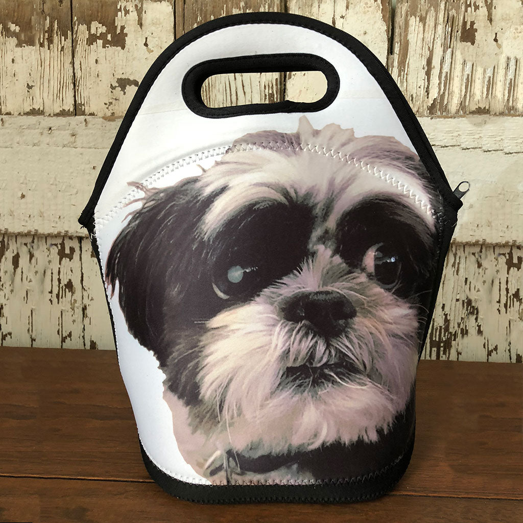 Insulated lunch bag with a photo of a cute black and white Shih Tzu printed on it.
