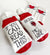 If You Can Read This Bring Me Wine Socks Sporty Red and White socks with a double gray stripe around the ankle with a heart in the center and the words, "If you can read this" on the bottom one sock and "Bring me Wine" with a water color image of a glass of red wine on the other sock.  These are white athletic type/casual socks with red toes and heels.