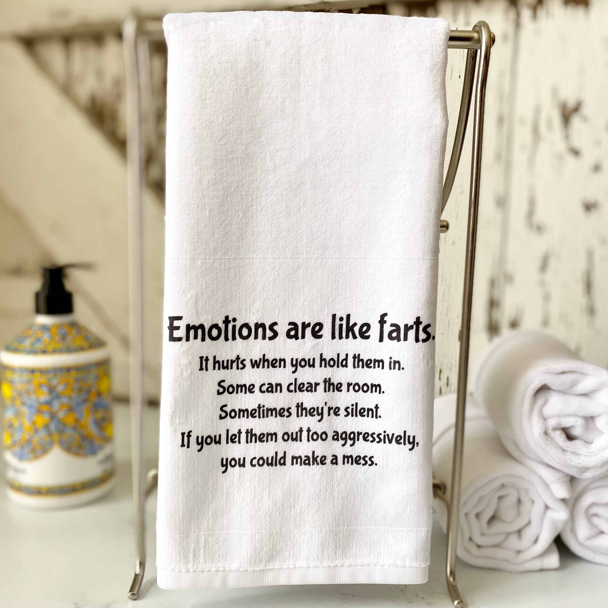 Hand Towel that says, &quot;Emotions are like farts. It hurts when you hold them in. Some can clear the room. Sometimes they&#39;re silent. If you let them out too aggressively, you could make a mess.&quot;